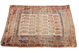 Rare antique Caucasian rug with distressed ivory field, repeating boteh motifs, and colorful geometric borders.