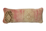 Vintage Oushak rug fragment pillow, muted pink, beige, and taupe with hand-knotted texture.
