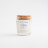 White Eucalyptus Lavender soy candle in clear glass tumbler with cork lid.