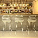 White powder-coated wire Lucy Counter Stool, highlighting geometric seat and back.