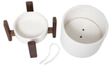 White ceramic pot with drainage holes, wooden stand, hidden drip tray, nylon string.