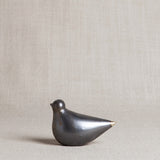 Sculptural black porcelain turtle dove with shimmering glaze and gold tail tip, 3