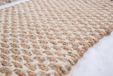 Hand-woven Charlette jute rug with chunky natural tan and ivory texture, neat edge.