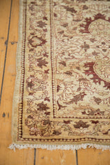 Close-up of the Egyptian runner's border, showing intricate vinery and the hand-knotted pile.