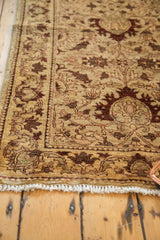 Intricate serrated leaf border and hand-knotted pile of a Sultanabad design Egyptian runner rug.