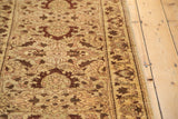 Close-up of serrated leaves and interconnecting vinery on an Egyptian Sultanabad style rug.
