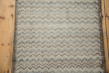 Textured chevron pattern on distressed Tulu rug, revealing ivory, charcoal, and slate blue tones.