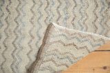 Reverse of distressed Tulu rug revealing hand-knotted foundation and chevron design.