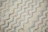 Distressed ivory, charcoal, and slate blue chevron pattern on vintage Tulu rug.