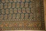 Patinaed corner of antique Tabriz rug; intricate charcoal oxidized silver boteh field and earthy borders.