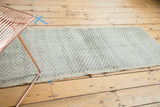 Distressed vintage Oushak runner's checker motif with color variation and textural wear.