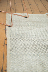 Distressed vintage Oushak runner with diminutive checker motif and even wear.
