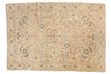 Distressed vintage Tabriz carpet, allover geometric design in ivory, warm brown, muted teal.