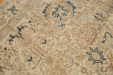 Vintage distressed Tabriz carpet section with faded ivory and coffee serrated geometric patterns.