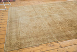 Distressed vintage Amritsar rug, low pile featuring Herati motif in antique ivory and gold.