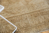 Distressed low pile texture and faded Herati motif of a vintage Amritsar rug.