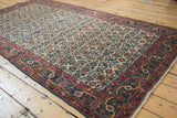 Vintage Halvai Bijar rug corner, Herati motif on ivory, with madder red and blue borders.