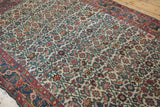 Intricate Herati motif on ivory ground with sky blue, madder red, and green hues.