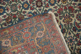 Vintage Halvai Bijar rug's intricate Herati pattern on ivory, with fringe and hand-knotted foundation visible.