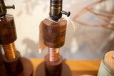 Vintage-style brass socket with turn-key switch on a solid dark oak Edison lamp base.