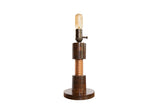 Handmade Edison lamp with a dark oak wood body, central copper coil, and a vintage bulb.