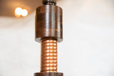 A close-up of the Edison lamp's solid oak body and hand-twisted copper coils.