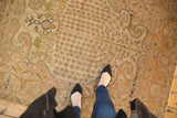 Vintage Sivas rug's soft ivory, bronze, and sky blue millefleur pattern with curvilinear arabesques.