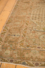 Textured corner of Vintage Sivas rug, with copper bronze arabesque and soft leaf borders.