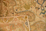 Folded corner of a Vintage Sivas rug, showing main border arabesques and subtle leaf minor border.