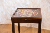 Painted vintage end table featuring original dot pattern in cream, gold, and red, with drawer.