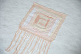 Lea Thomas quilt weaving detail with soft, hand-dyed peach and ivory fabric squares.