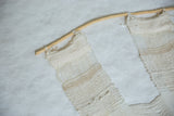 Close-up of Lea Thomas Magnolia Weaving's light, airy texture with natural hand-dyed yarns.