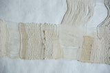Lea Thomas handmade weaving displaying diverse textures and soft hand-dyed off-white yarns.
