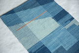 Lea Thomas Heritage 2 Weaving showing textured, hand-dyed blue yarn patches and orange line.
