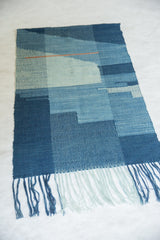 Close-up of Lea Thomas Heritage weaving fringe, revealing varying shades of blue.