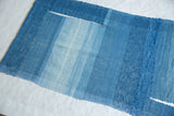Lea Thomas weaving detail, showing hand-dyed blue yarn textures and natural openings.