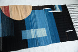 Bottom section of Lea Thomas weaving, highlighting dark blue and black woven textures and fringe.