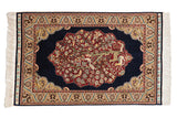 Vintage Hereke rug with a pictorial Tree of Life medallion featuring birds and deer on a dark navy field.