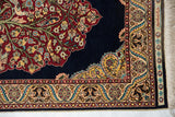 Signed kilim end and intricate floral border on a vintage fine Hereke Turkish rug.