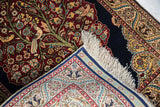 View of the mixed-weave kilim skirt and pictorial pile on a fine vintage Hereke rug.