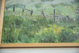 Grace B. Keogh painting's textured green brushstrokes, fence, and natural wood frame.