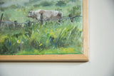 Detail of yellow GBK artist signature on green painted grass, light wood frame.