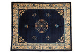 Vintage Peking carpet, central roundel medallion, scrolling floral vinery on cobalt blue, ivory borders.