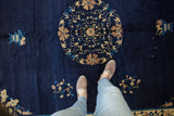 Vintage Peking carpet with floral roundel medallion, scrolling vinery, and cobalt blue field.