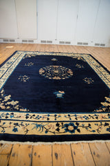 Vintage Peking carpet's fluid main border with scrolling beige and blue florals.
