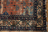 Malayer rug corner, rust field vinery, blue and beige borders, and black machine binding.