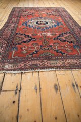 Vintage Malayer rug corner, showing classic Serbend border, visible tatter, and wear.