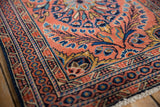 Intact selvage and even pile of the vintage Dargezine rug's brick red and navy border.