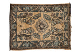 Distressed vintage Lilihan rug with a floral medallion, blue trees, and a human figure on a beige field.