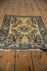 Low angle view showing the distressed pile and frayed edges of a vintage Persian Lilihan rug mat.